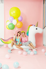 Summer Fun. Happy Women Friends In Fashion Clothes With Balloons