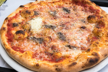 Tasty Italian pizza with anchovies