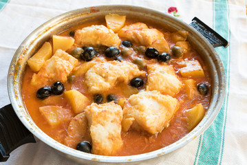 Salted cod stewed with olives