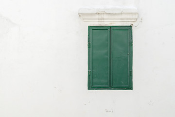 Old green window on the wall., with copy space for text.
