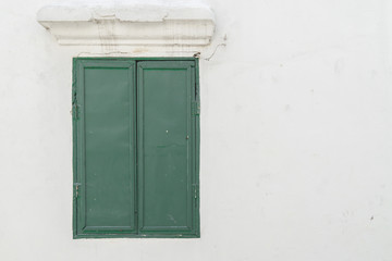 Old green window on the wall., with copy space for text.