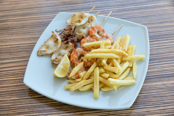 Fish skewers with fries