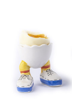 boiled egg open half with legs isolate