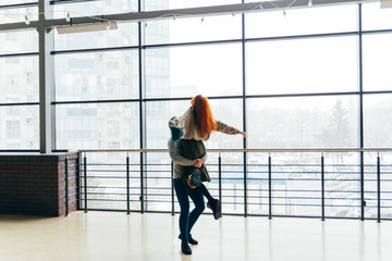 silhouette of dancing couple on a window background. holding hands. love, confession, offer.