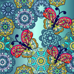 Seamless pattern with mandala and decorative butterflies