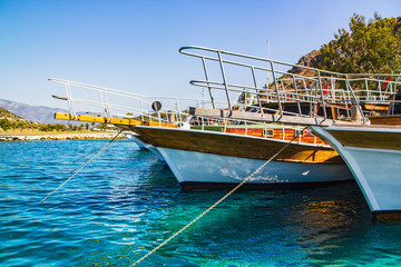 Yachts moored to the pier in the marina