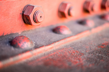 row of bolt, screw  and nuts closeup -  steel construction detail