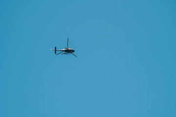 helicopter flying against the blue sky. Moscow, Russia