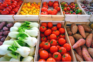Crates of colorful vegetables at a French farmers market