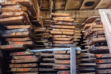 sawmill, warehouse of wooden boards in the factory.