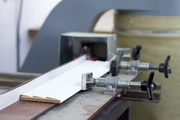 Press bonding. Metal glue press for wood frame on fixed table.