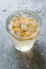 Pear Juice Cocktail with Dried Pear Slice and Crushed Ice.