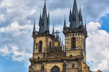 Fototapeta na wymiar Church of our Lady before Tyn Prague - Architectural image in Old Town Square, in Prague, Czech Republic with Chram Matky Bozi pred Tynem with partly cloudy sky