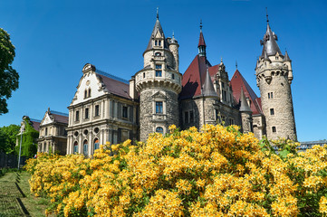 Obraz premium Neo-Gothic towers of the historic Moszna castle in Poland.