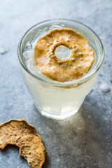 Pear Juice Cocktail with Dried Pear Slice and Crushed Ice.