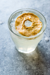 Pear Juice Cocktail with Dried Pear Slice and Crushed Ice.