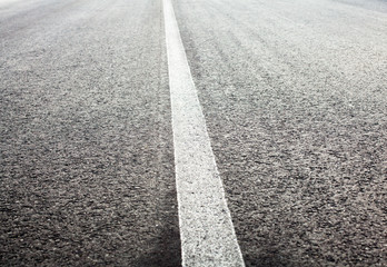 Unbroken white road marking line