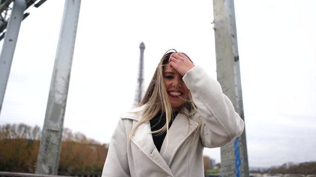 Beautiful blonde woman who enjoys Paris