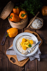Chicken strips with rice and sweet mirabelle in curry sauce