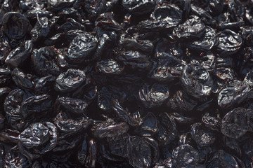 Prunes by closeup. Background of prunes