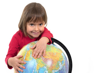 The cheerful child and the globe close up on the white isolated background.