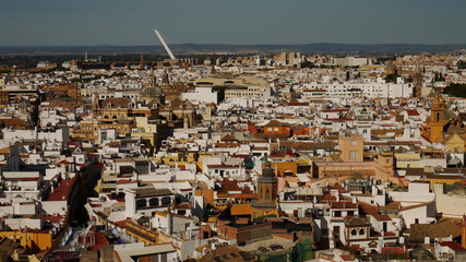 Seville cityscape with old and new buildings in Seville, Spain, Andalusia, with hills in distance