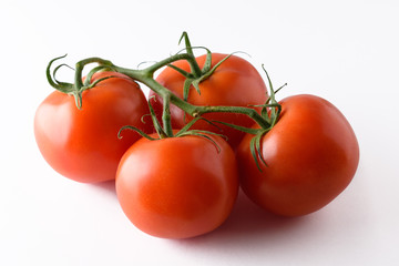 Fresh tomatoes isolated on white background.