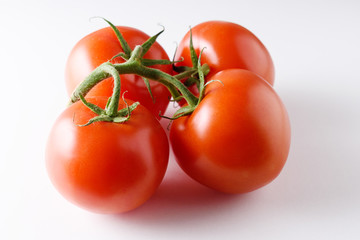Fresh tomatoes isolated on white background.