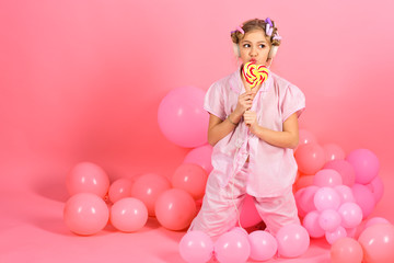 Obraz na płótnie Canvas Happy smiling child with sweet lollipop
