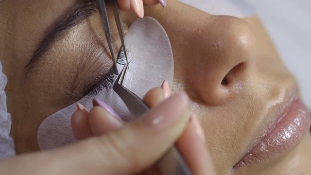 Process of making eyelash extension in beauty salon