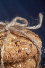 Vegan crunchy cookies with sunflower, flax seeds and sesame seeds isolated. Macro view