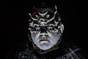 Alien, demon, sorcerer makeup. Horror and fantasy concept. Man with third eye, thorns or warts....