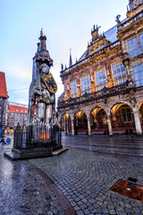 The Bremen Roland statue and Old Town Hall in the market square (Rathausplatz) of Bremen, Germany,...