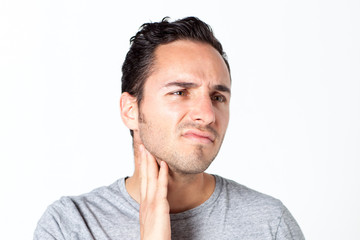 Man in gray T-shirt with toothache 
