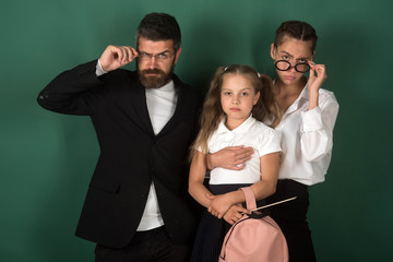 company of bearded man teacher and girls students having fun together friends on green background.