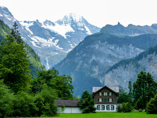 Switzerland, Lauterbrunnen, SCENIC VIEW OF SNOWCAPPED MOUNTAINS AND TREES DURING WINTER