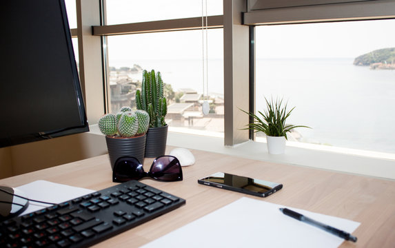 Modern office interior with seascape view.