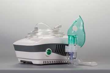 Compressor inhaler for physiotherapy, on gray