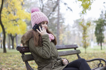 Girl talking on phone in park