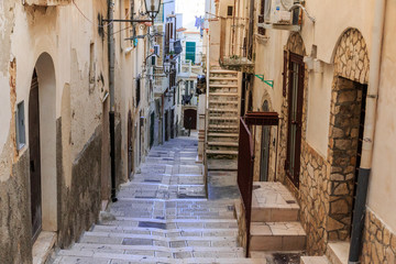Fototapeta na wymiar Italy, Foggia, Apulia, SE Italy, Gargano National Park, Vieste. Old city, pedestrian streets. Stairways between neighborhoods.