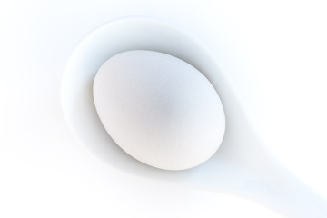 egg on spoon white porcelain with space copy