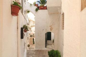 Italy, SE Italy, Ostuni. Old town narrow alleyways, arches. The "White City."