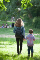 Brothers walking in spring sunny park