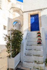 Fototapeta na wymiar Italy, SE Italy, Ostuni. Narrow, arched old town . Blue Doorways.The 