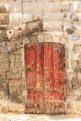 Italy, southern Italy. Puglia. Small comune of the Metropolitan City of Bari, Alberobello. UNESCO World Heritage site. Door in a wall.