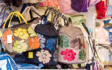 Bags with floral ornament, Tokyo, Japan. Close-up.