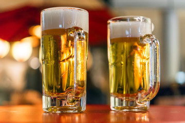 Two glasses with beer on the table, Tokyo, Japan. Close-up.