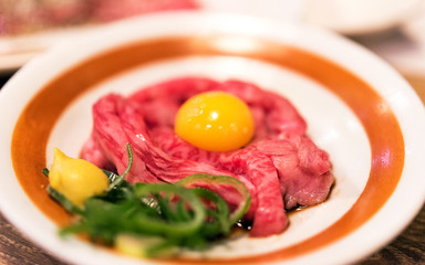 Japanese dish of beef with raw egg, Tokyo, Japan. Close-up.