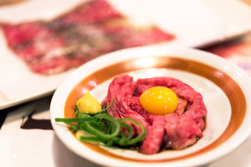 Japanese dish of beef with raw egg, Tokyo, Japan. Close-up.