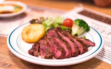 Fried beef with potatoes, decorated with vegetables, Tokyo, Japan. Close-up.
